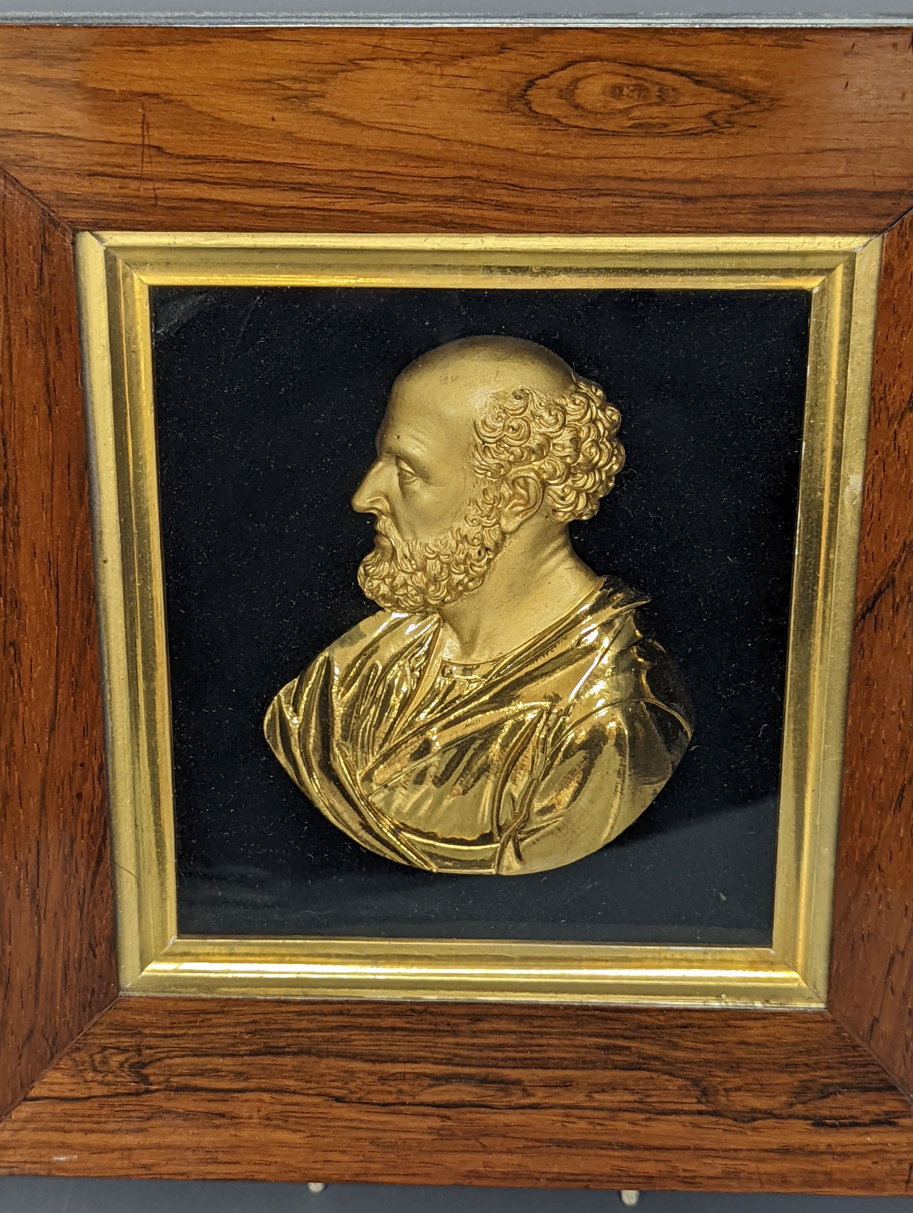 A pair of mid 19th century gilt-bronze portrait reliefs of Greek philosophers?, each in rosewood frames, width 23cm overall